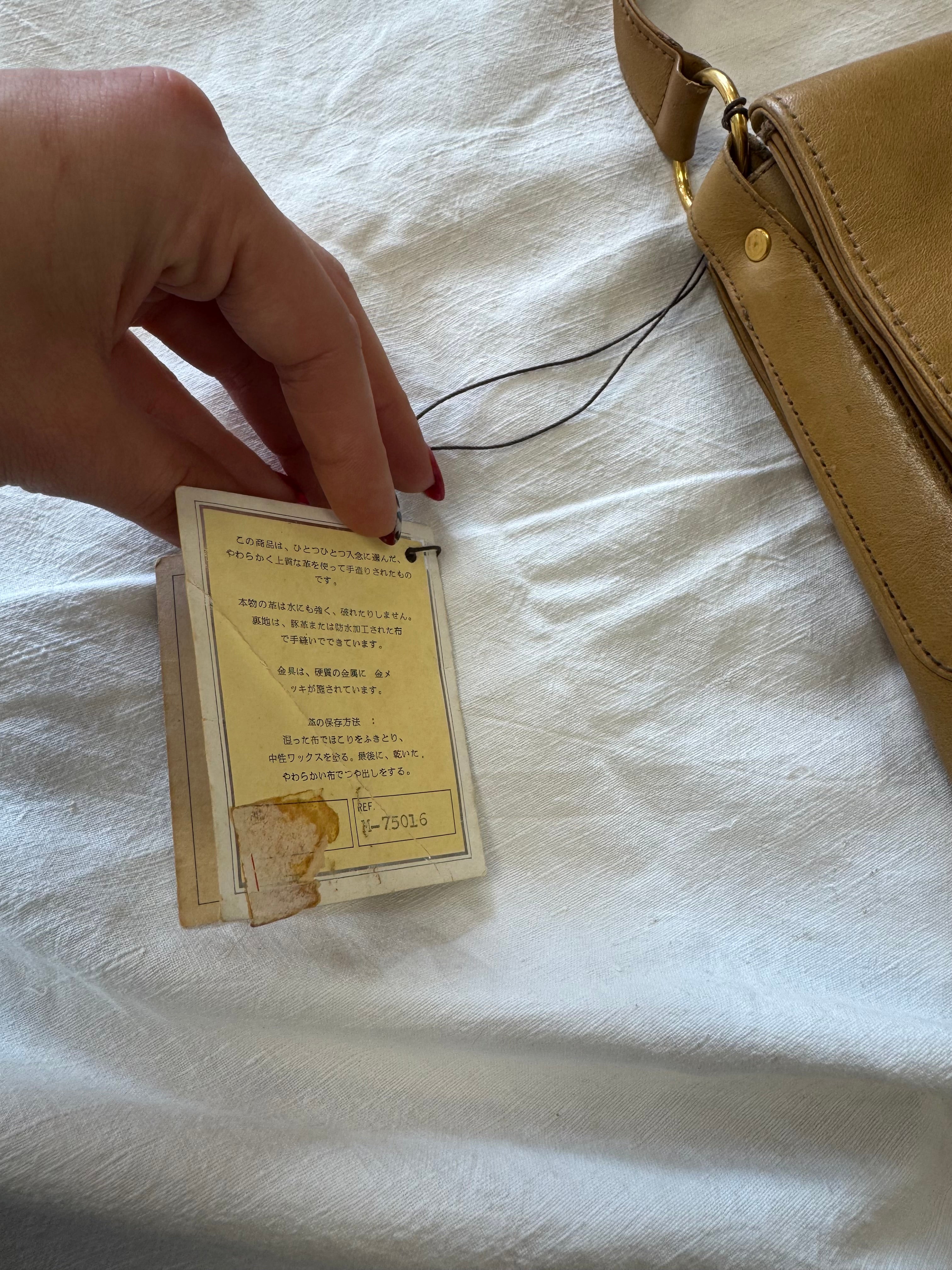 Sac baguette en cuir beige Nina Ricci