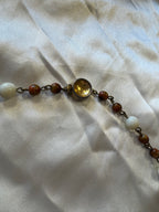 Collier marron et blanc